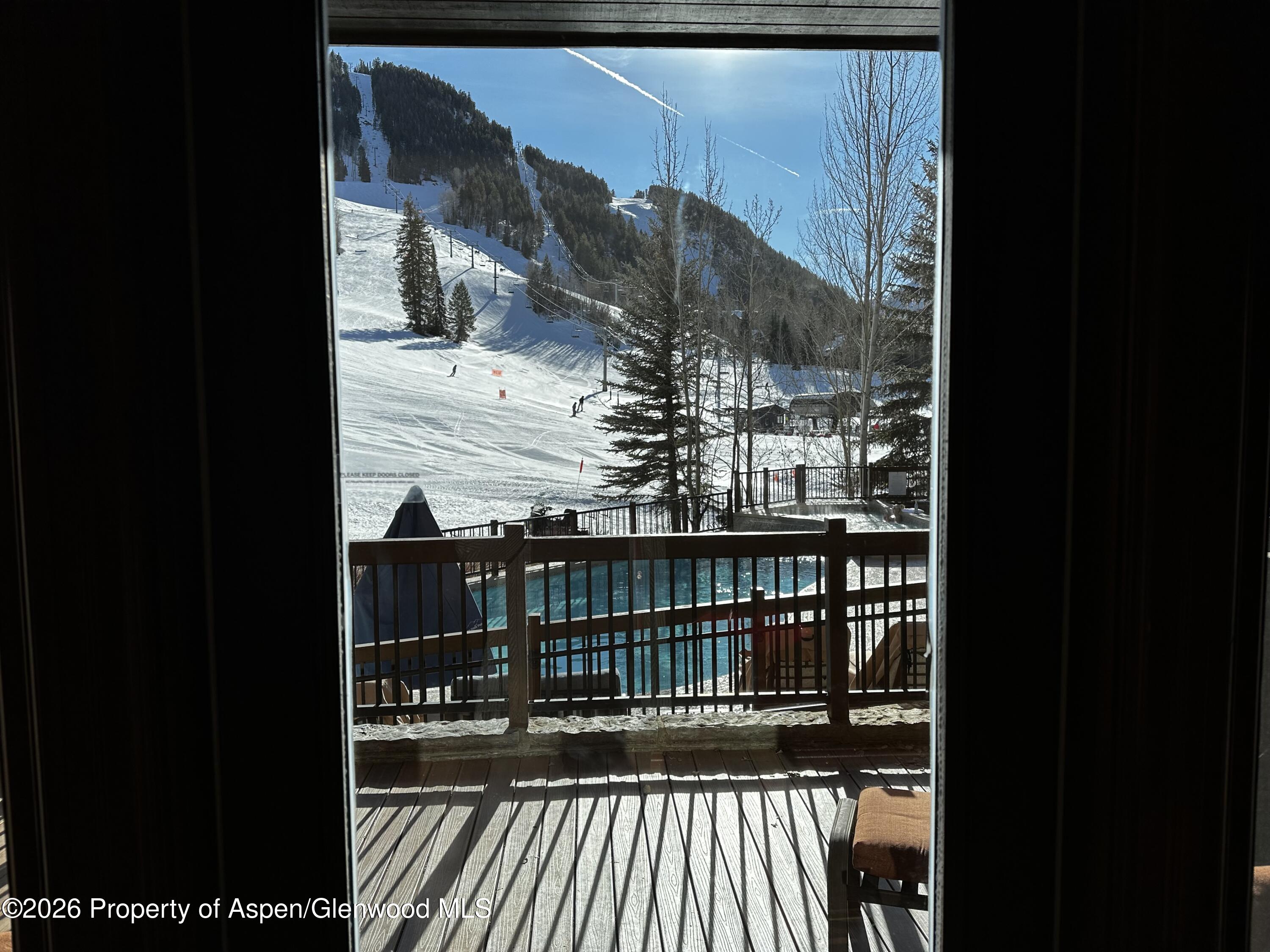197 Prospector Road, Unit 22052 Aspen, CO 81611 - Photo 7 of 22 a view of a balcony with a door
