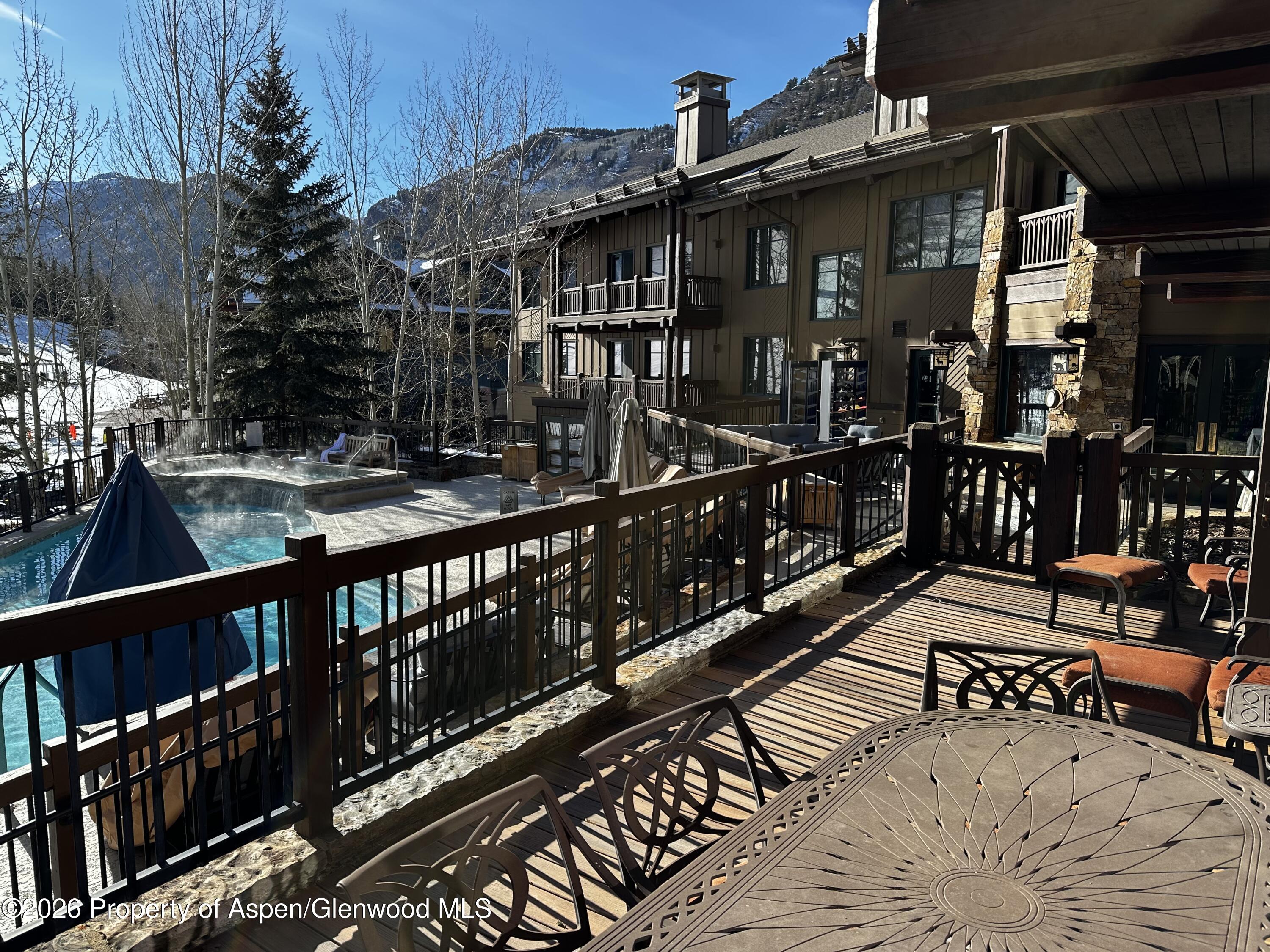 197 Prospector Road, Unit 22052 Aspen, CO 81611 - Photo 8 of 22 a view of a house with wooden deck