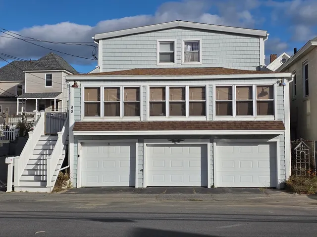 a view of a white building with a window