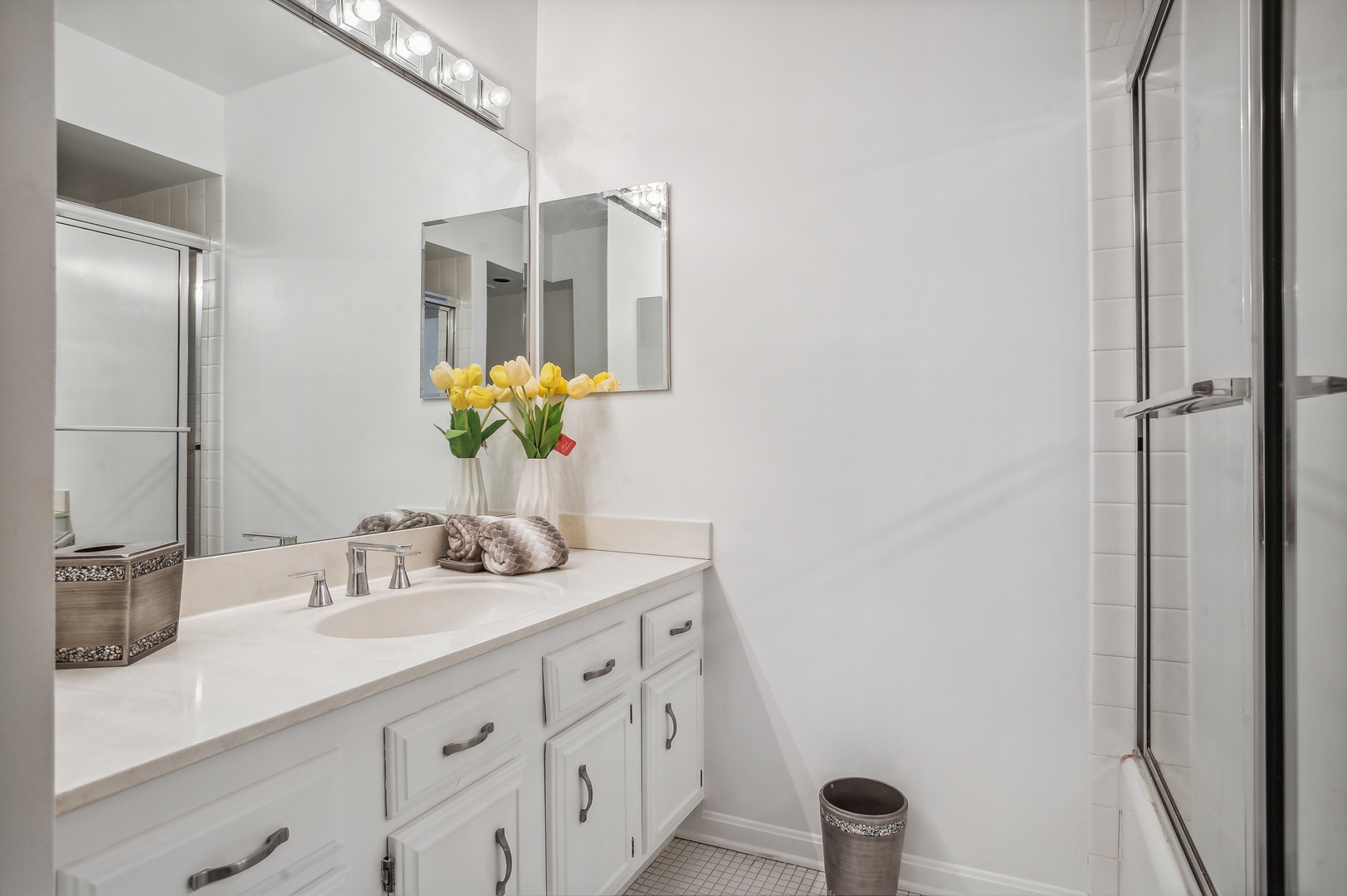 3900 Mission Hills Road, Unit 204 Northbrook, IL 60062 - Photo 11 of 15 a bathroom with a granite countertop sink and a mirror
