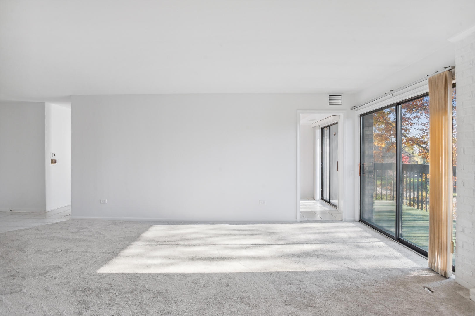3900 Mission Hills Road, Unit 204 Northbrook, IL 60062 - Photo 5 of 15 a view of room with wooden floor and fan
