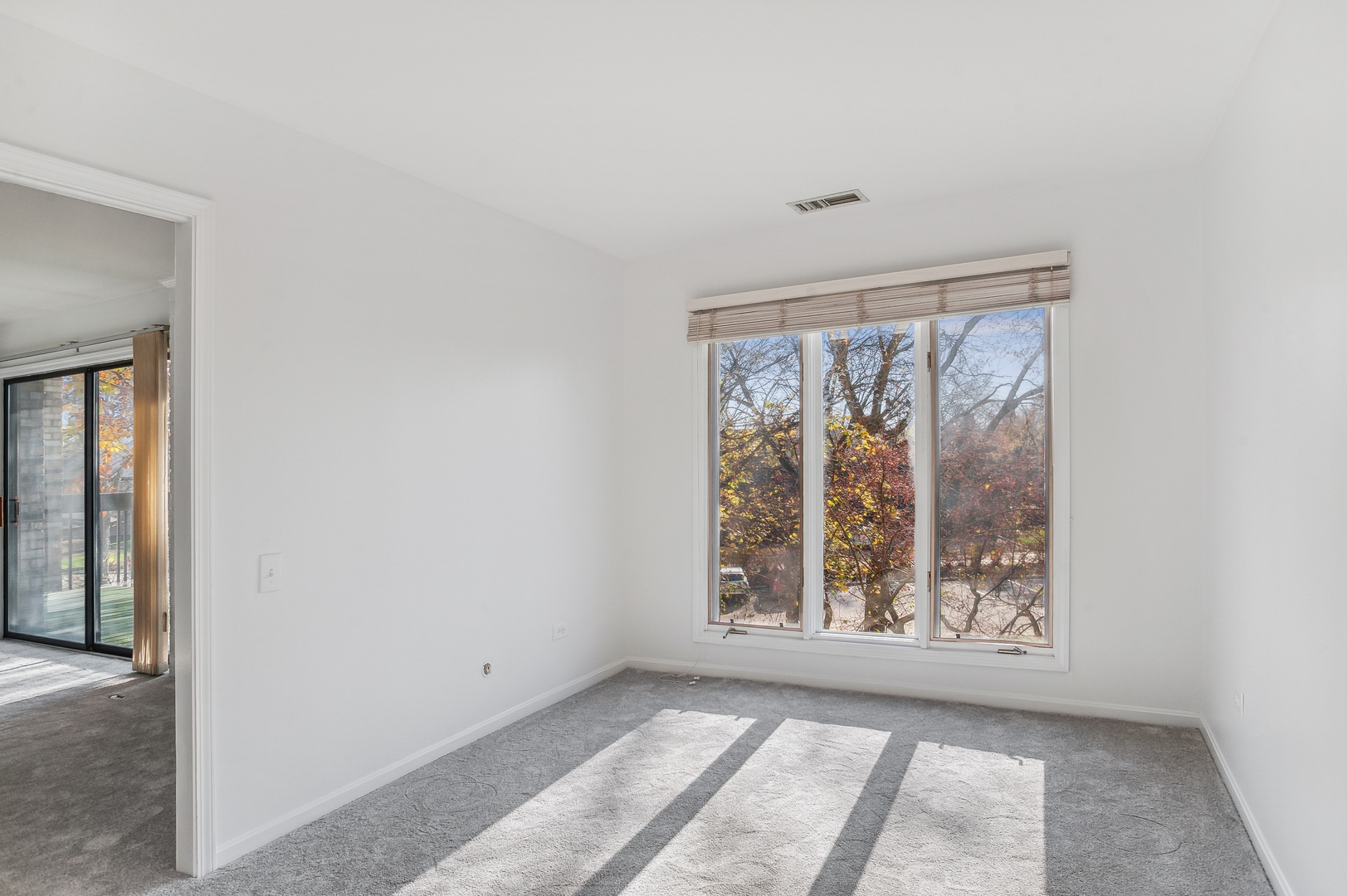 3900 Mission Hills Road, Unit 204 Northbrook, IL 60062 - Photo 7 of 15 a view of an empty room with windows