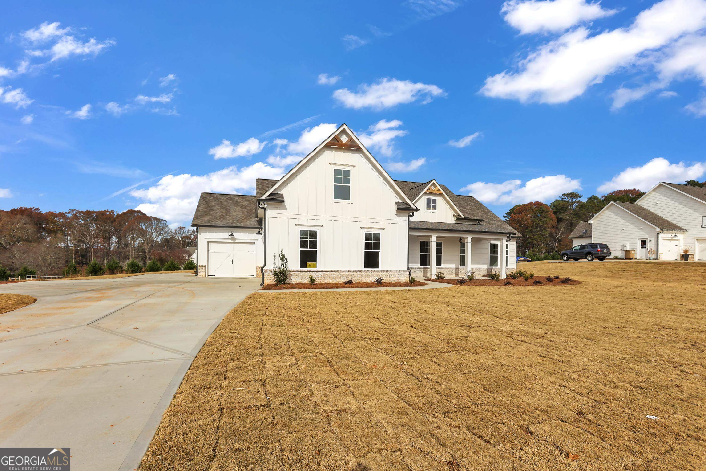 856 Smith Mill Road, Unit 6 Winder, GA 30680 - Photo 1 of 1 a view of a house with a yard