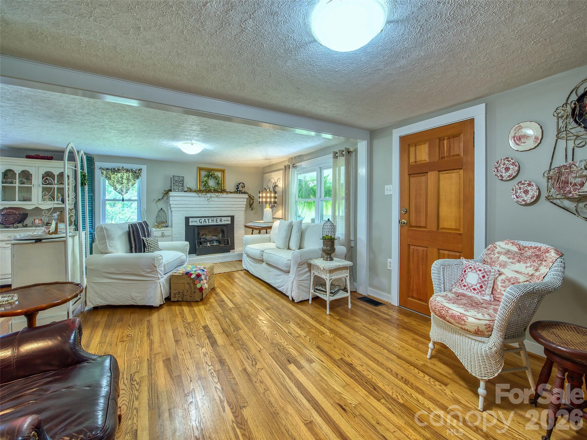 9 Whitted Road Canton, NC 28716 - Photo 13 of 24 a living room with furniture and a fireplace