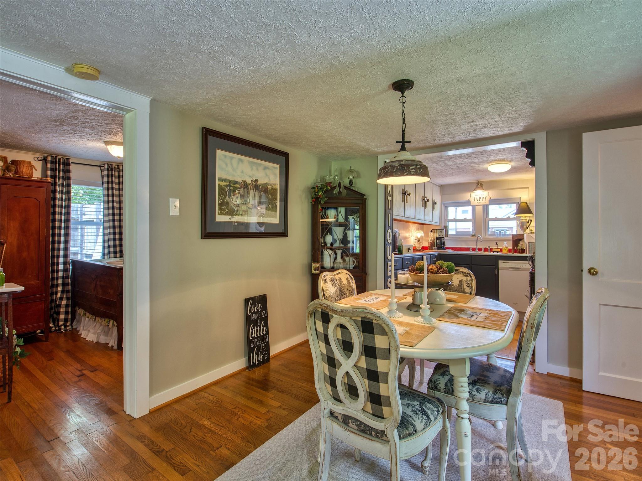 9 Whitted Road Canton, NC 28716 - Photo 16 of 24 a dining room with furniture window and wooden floor