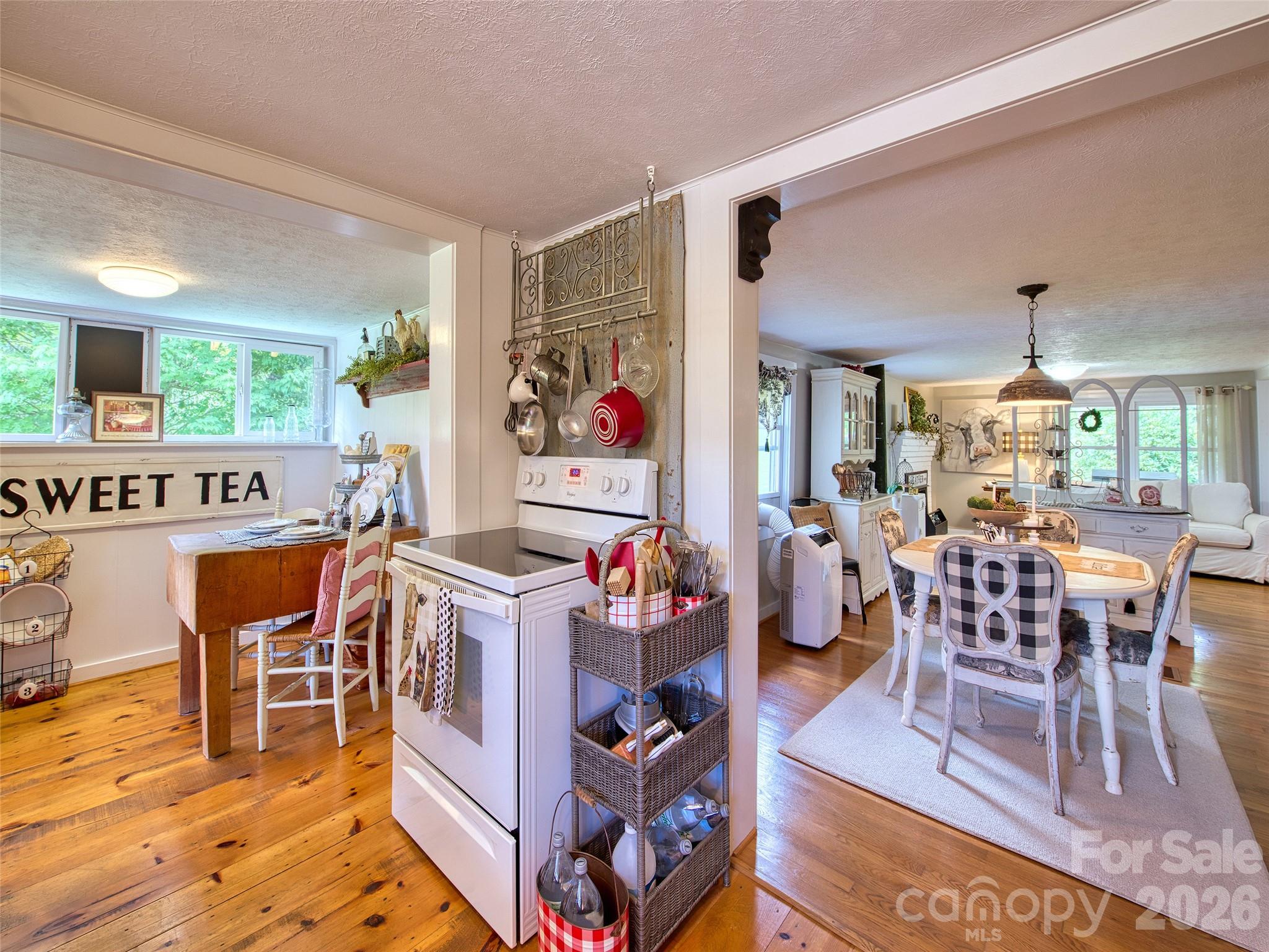 9 Whitted Road Canton, NC 28716 - Photo 18 of 24 a dining room with furniture a rug and wooden floor