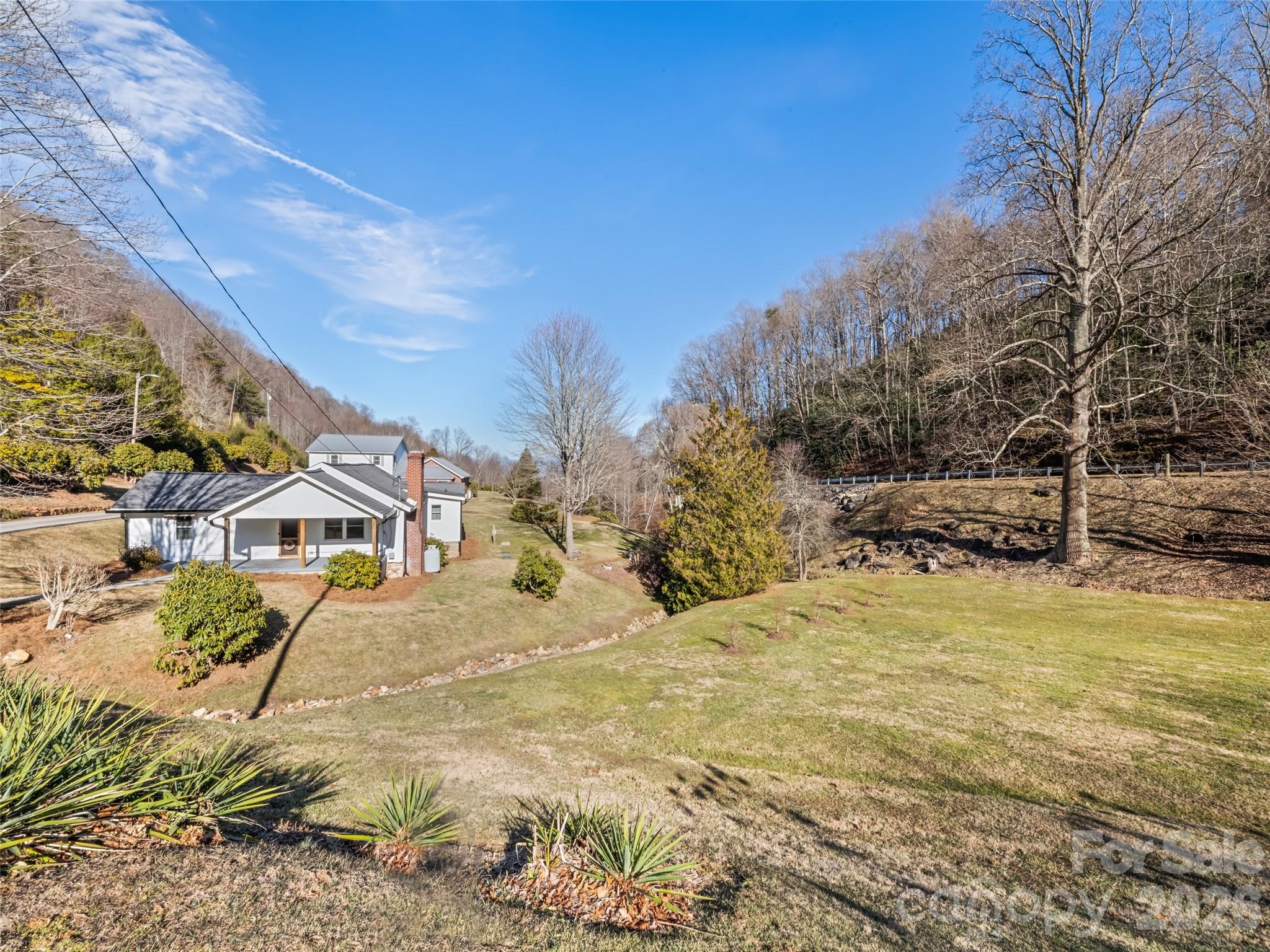 9 Whitted Road Canton, NC 28716 - Photo 3 of 24 a view of swimming pool with a house in the background