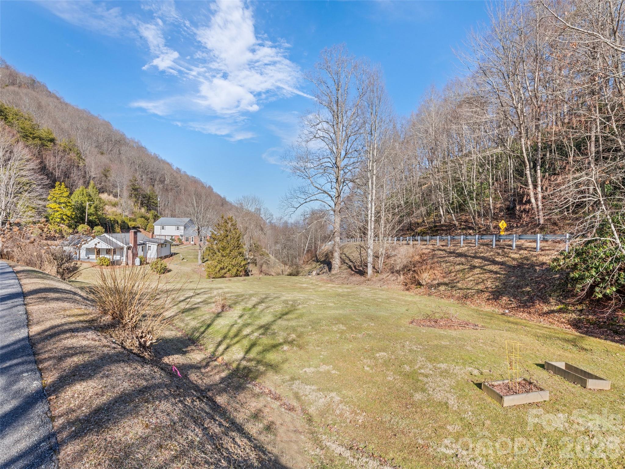 9 Whitted Road Canton, NC 28716 - Photo 4 of 24 a view of a yard with snow on the road