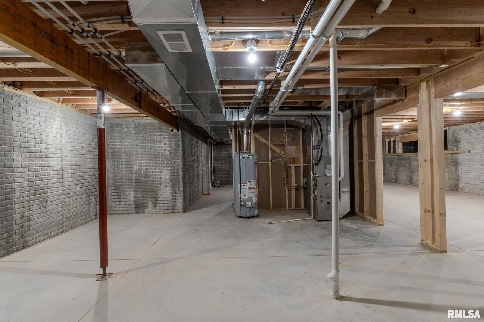 941 9th Avenue North Clinton, IA 52732 - Photo 23 of 24 a view of water heater room with staircase