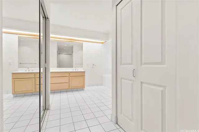 a bathroom with a tub shower and sink