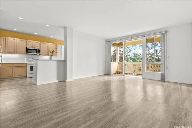 a view of a kitchen with a sink and a stove top oven