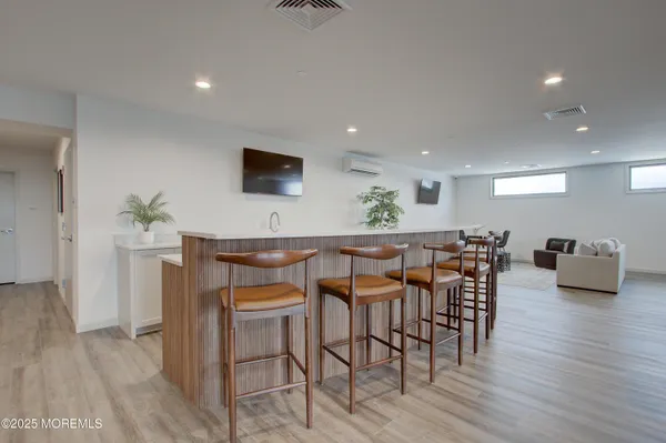 a living room filled with furniture and a large window