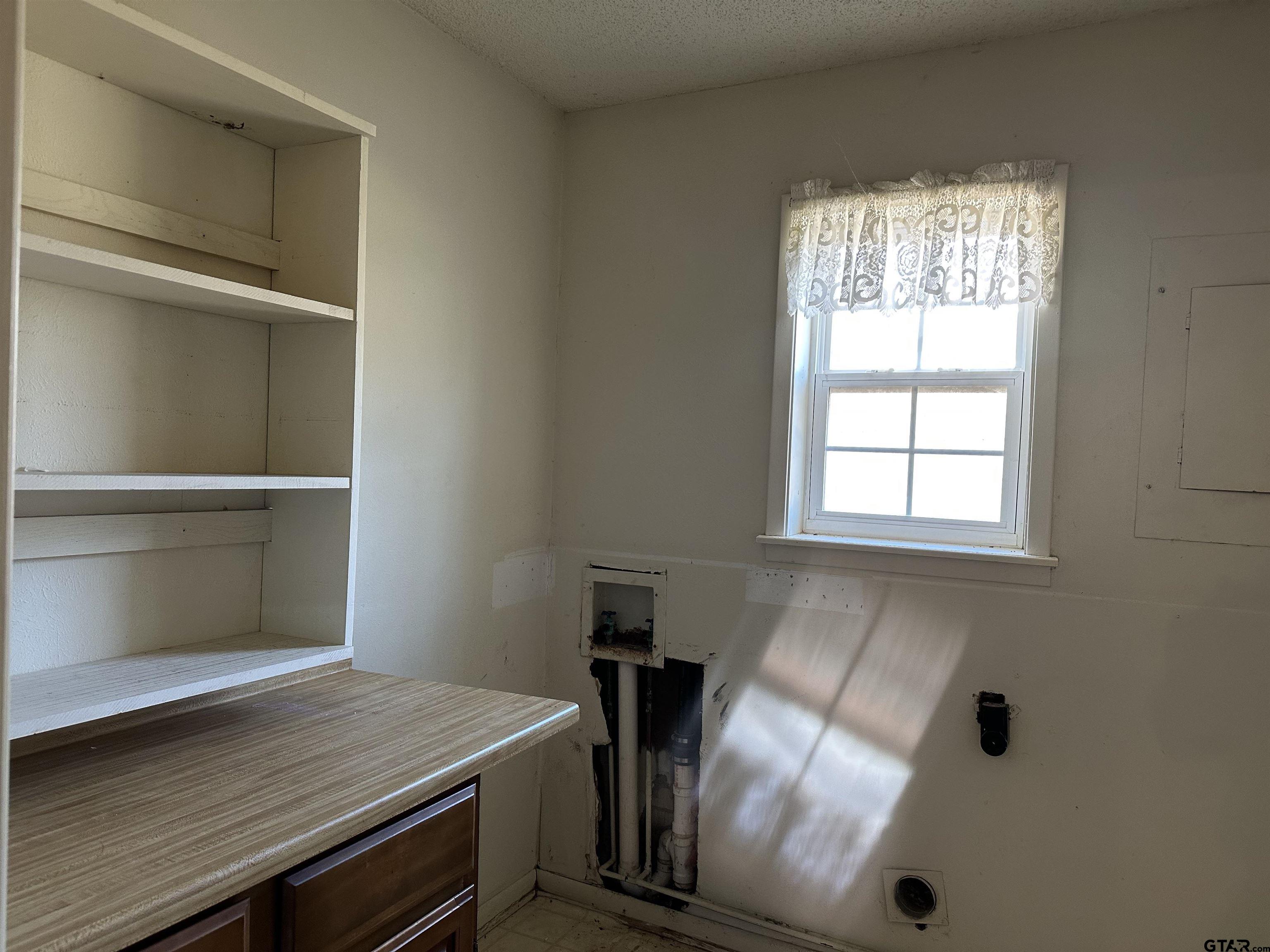 957 Farm To Market 23 Rusk, TX 75785 - Photo 11 of 25 a view of a room with rack and window