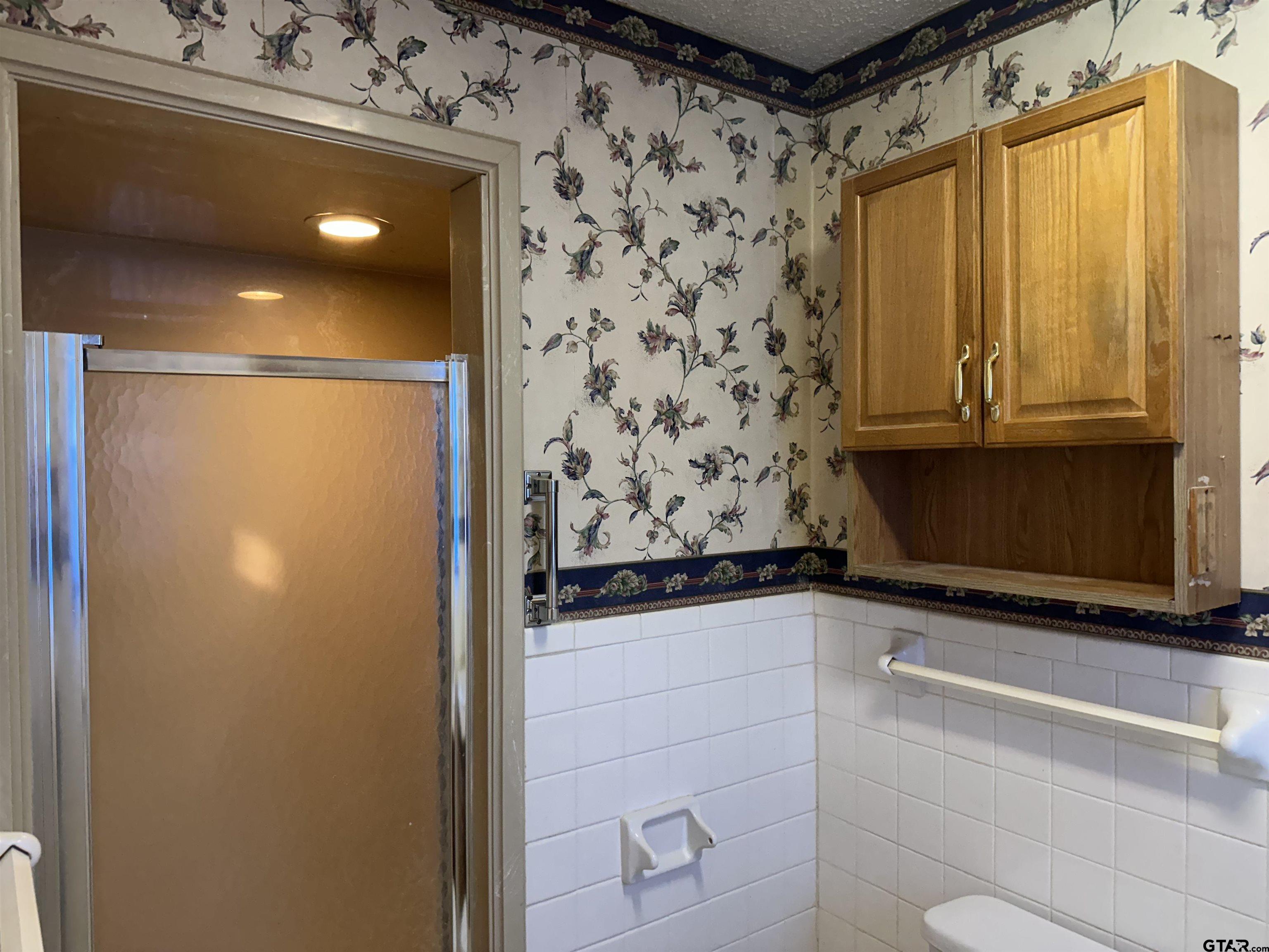 957 Farm To Market 23 Rusk, TX 75785 - Photo 21 of 25 a bathroom with a sink and a mirror
