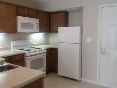 1 Kanawha Terrace Other, WV 25177 - Photo 14 of 15 a kitchen with a refrigerator sink and cabinets