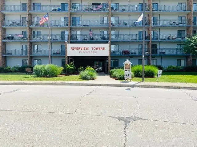 a view of backyard with seating area and green space