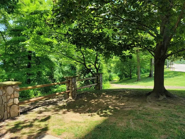 a view of a park with seating space