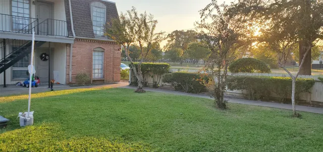 a backyard of a house with lots of green space