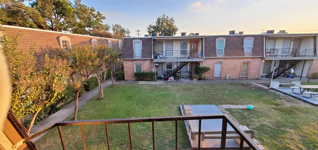 a view of a garden from a balcony