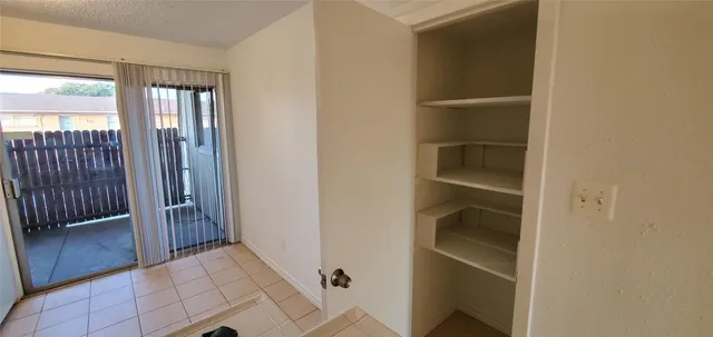 a view of an empty walk in closet