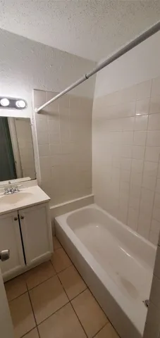 a bathroom with a sink and shower