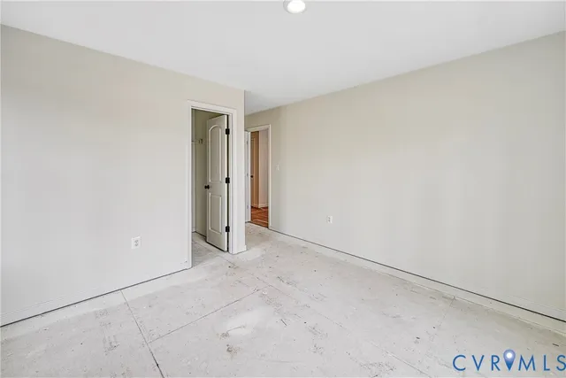 a bathroom with a granite countertop sink a mirror and a bathtub