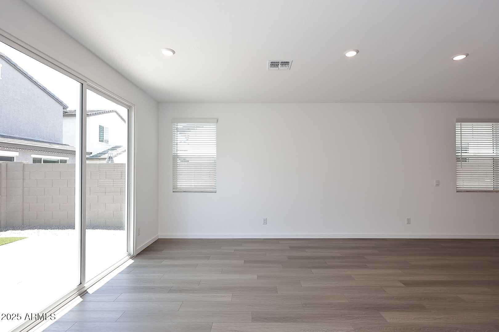 2442 West Rowel Road Phoenix, AZ 85085 - Photo 9 of 55 a view of an empty room and window