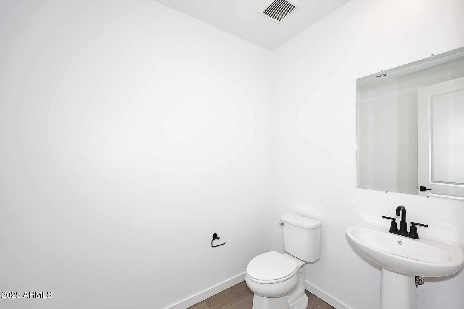 2442 West Rowel Road Phoenix, AZ 85085 - Photo 16 of 55 a bathroom with a sink mirror and toilet