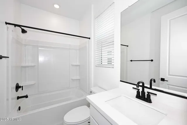 a bathroom with a shower and a bath tub