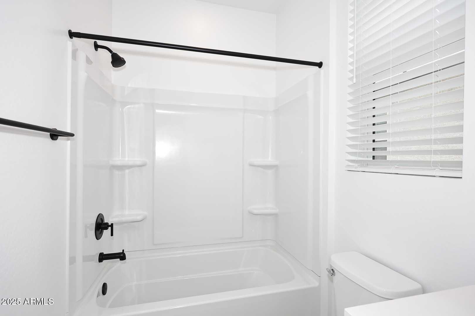 2442 West Rowel Road Phoenix, AZ 85085 - Photo 31 of 55 a bathroom with a shower and a bath tub