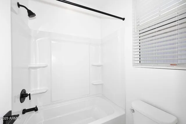 a room with a sink cabinets and utility