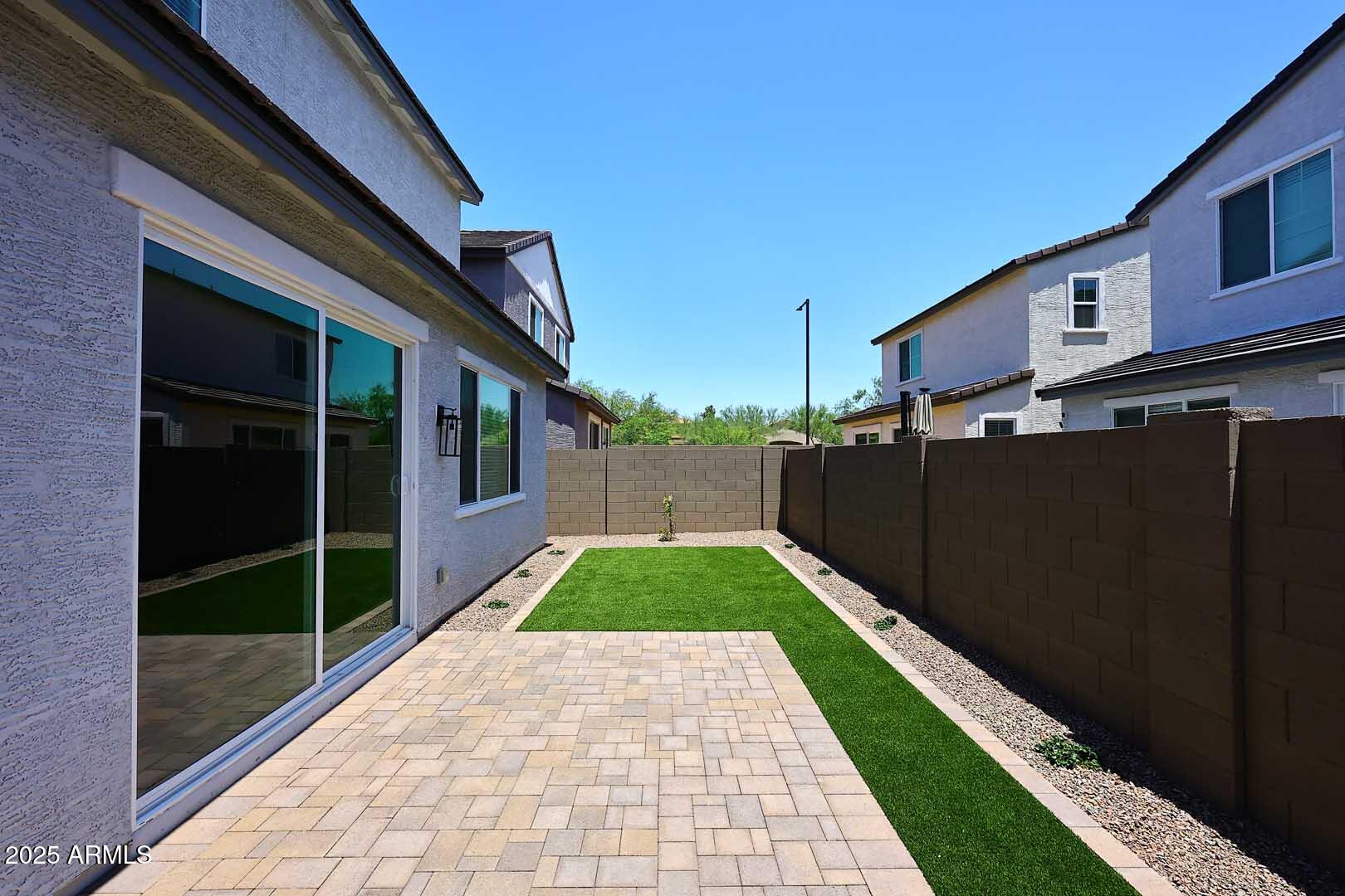 2442 West Rowel Road Phoenix, AZ 85085 - Photo 40 of 55 a view of a pathway both side of a house