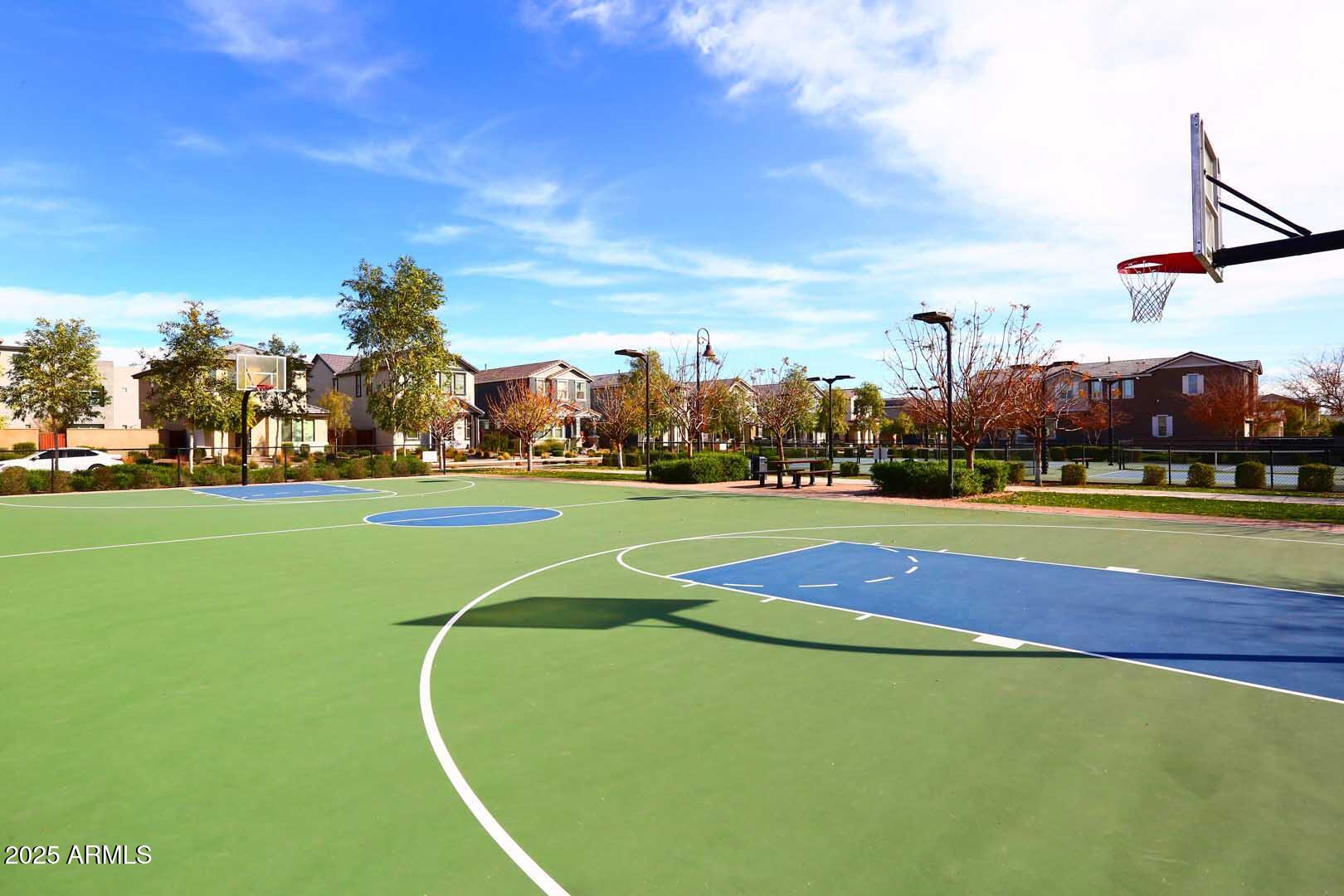 2442 West Rowel Road Phoenix, AZ 85085 - Photo 50 of 55 a view of a tennis ground with large trees