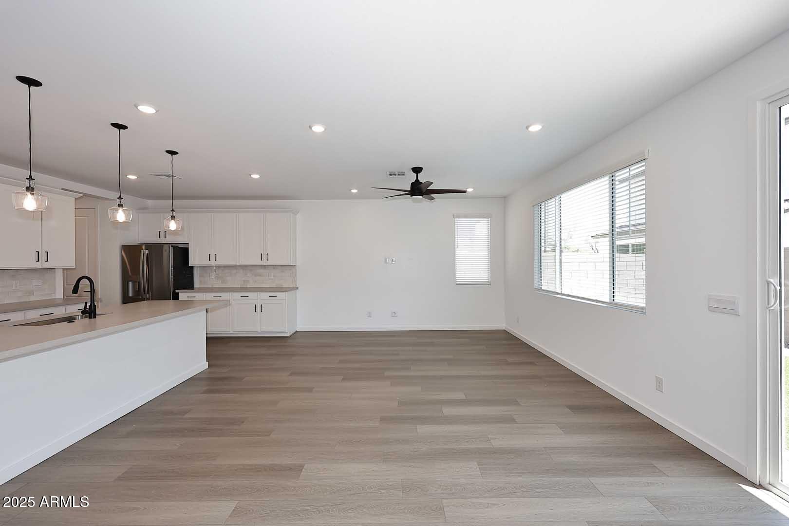 2442 West Rowel Road Phoenix, AZ 85085 - Photo 6 of 55 a view of kitchen with sink and wooden floor