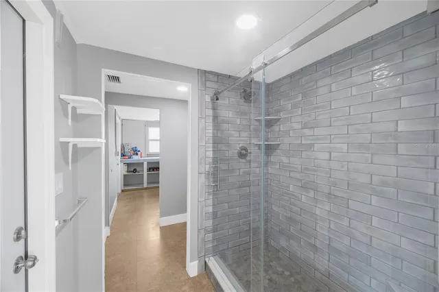 a en suite bathroom with a sink and a mirror