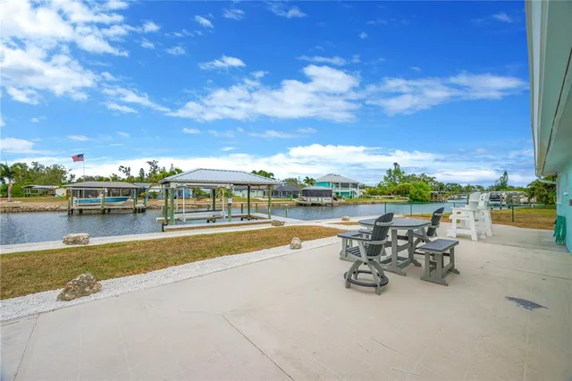 a view of swimming pool with outdoor seating and city view