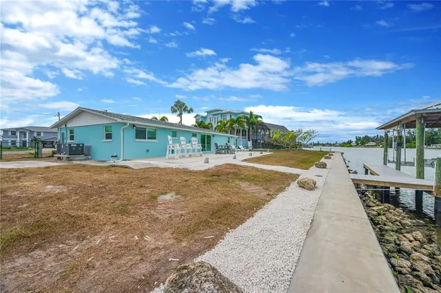 a view of swimming pool with outdoor seating and plants