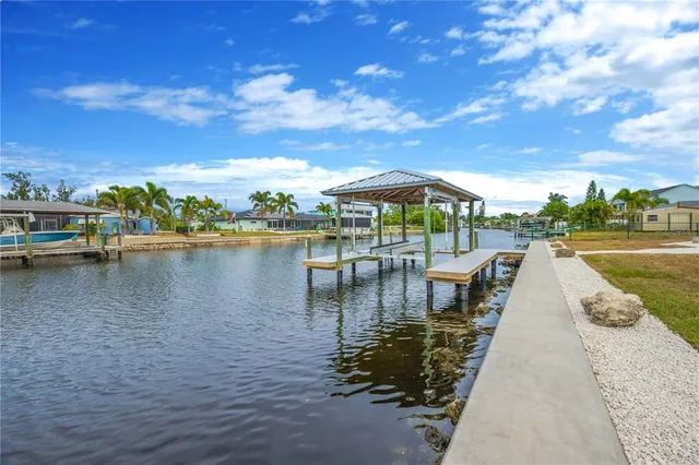 a view of a lake with sitting area