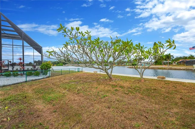 an aerial view of a house with a lake view