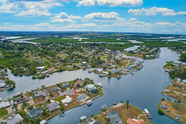 an aerial view of a residential houses with outdoor space