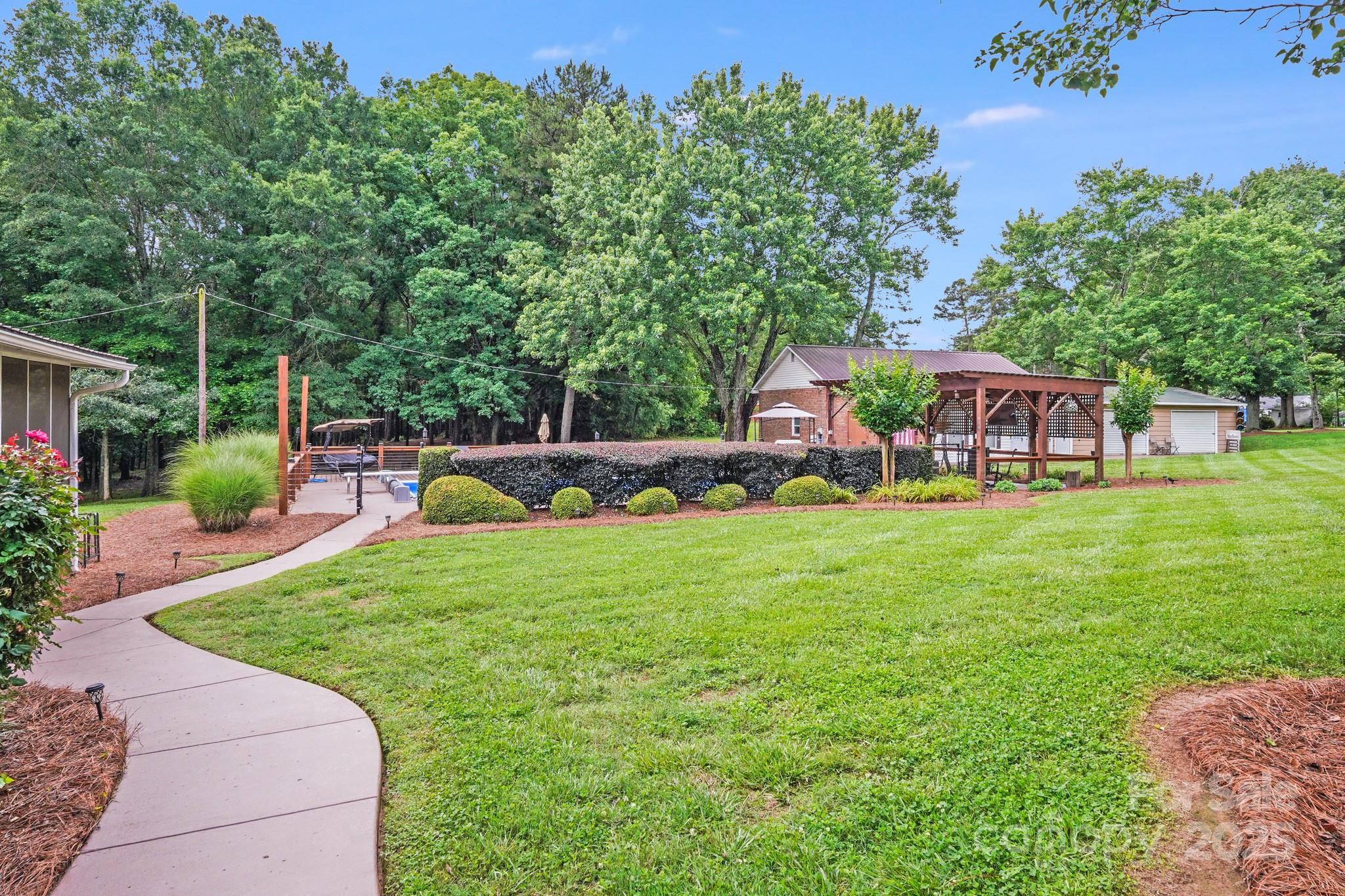 211 Drive Inn Road Locust, NC 28097 - Photo 13 of 48 a house view with a garden space