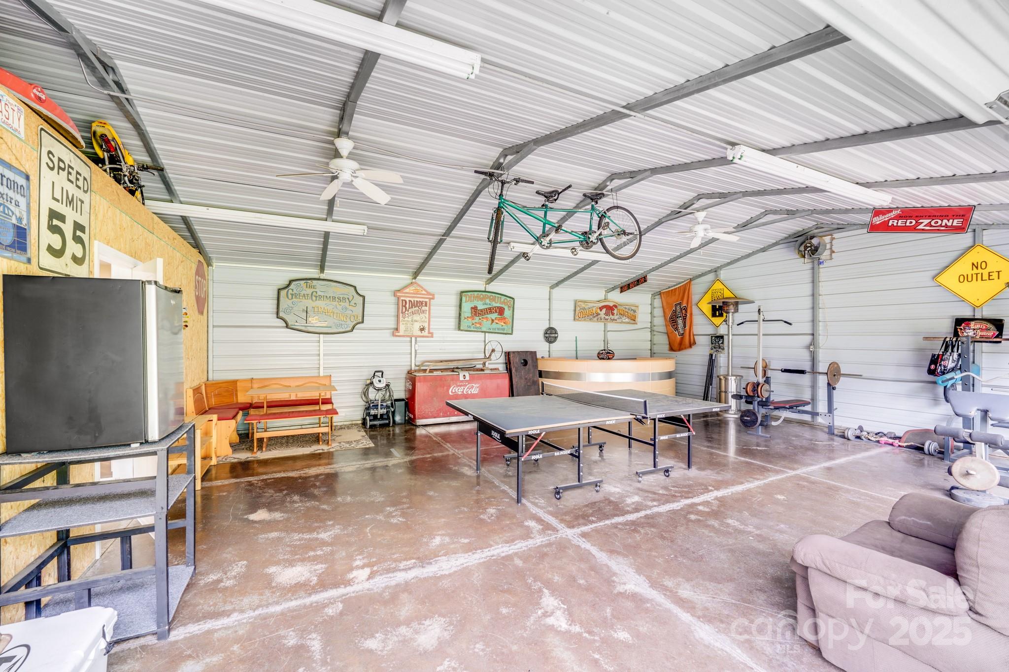 211 Drive Inn Road Locust, NC 28097 - Photo 26 of 48 a living room with lots of furniture and flat screen tv