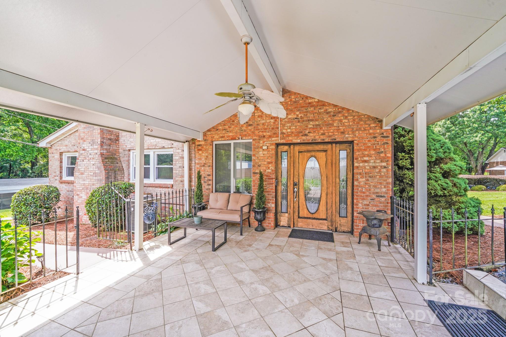 211 Drive Inn Road Locust, NC 28097 - Photo 4 of 48 a front view of a house with outdoor seating