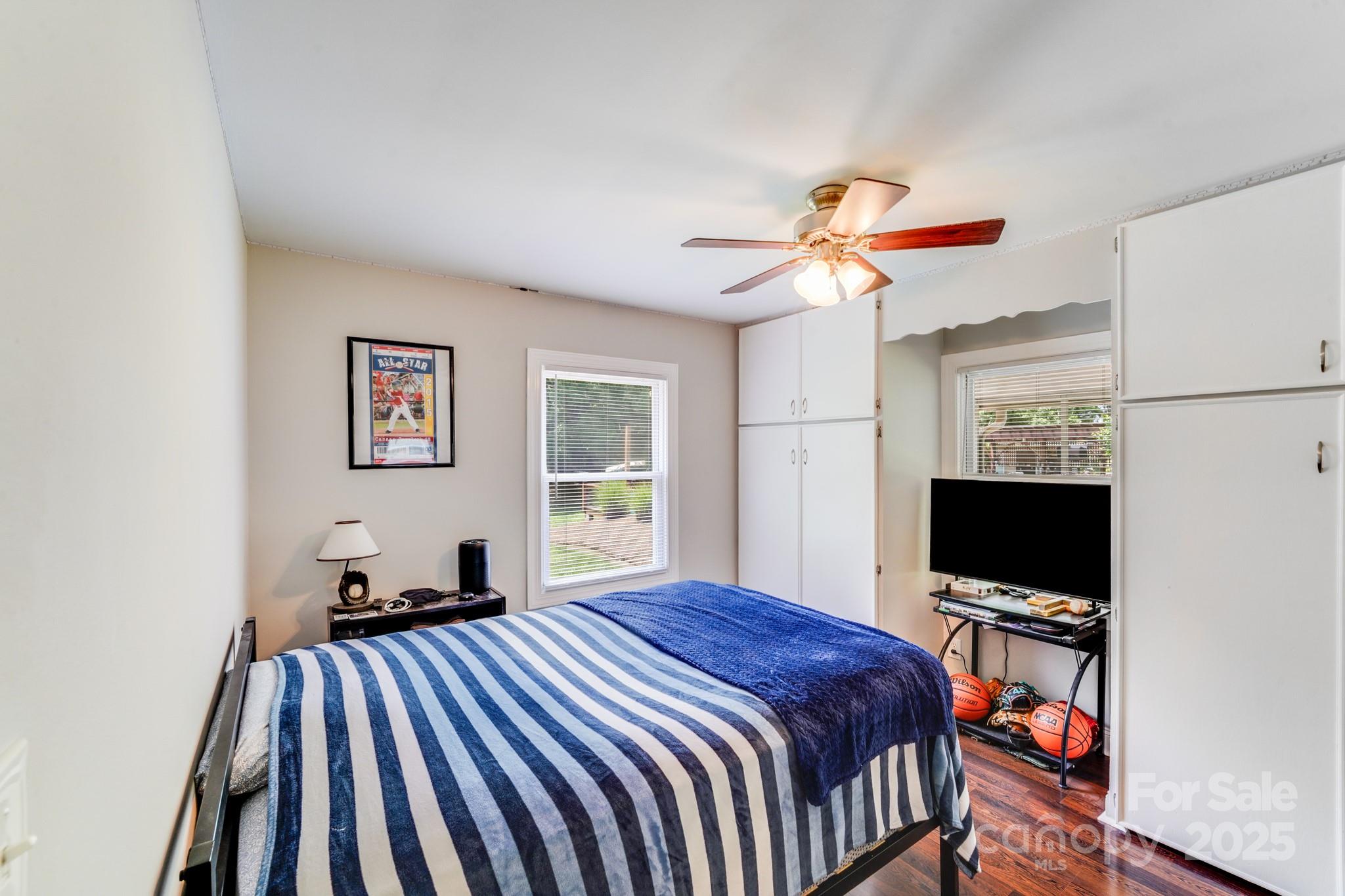 211 Drive Inn Road Locust, NC 28097 - Photo 42 of 48 a bedroom with a bed and a flat screen tv