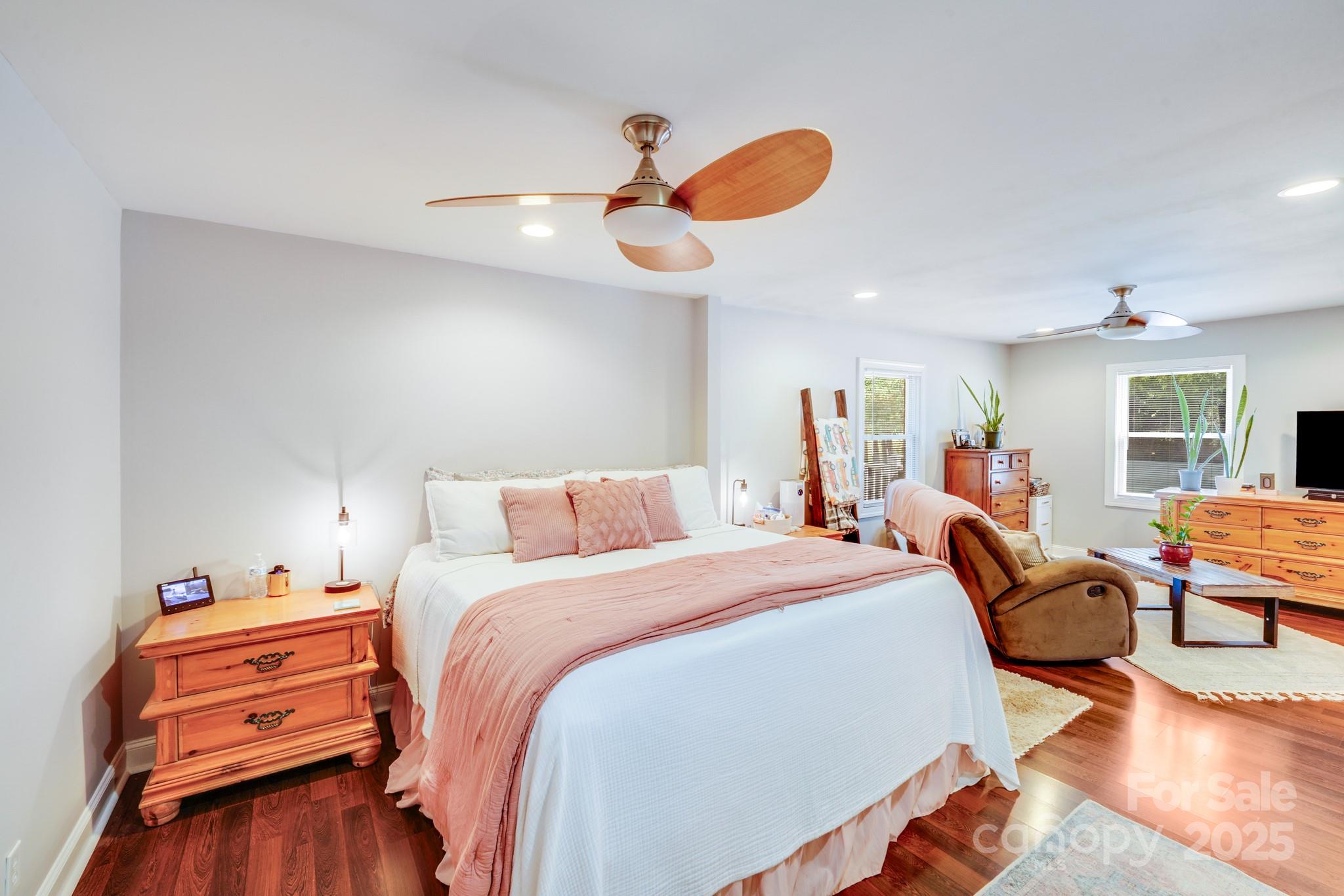 211 Drive Inn Road Locust, NC 28097 - Photo 44 of 48 a bedroom with a bed and wooden floor