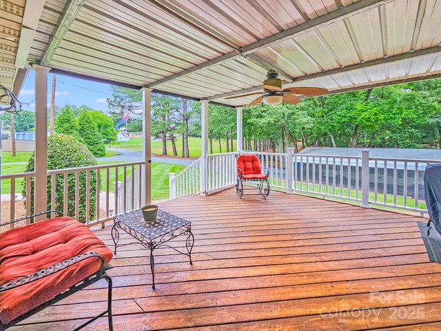 a view of a patio with wooden floor
