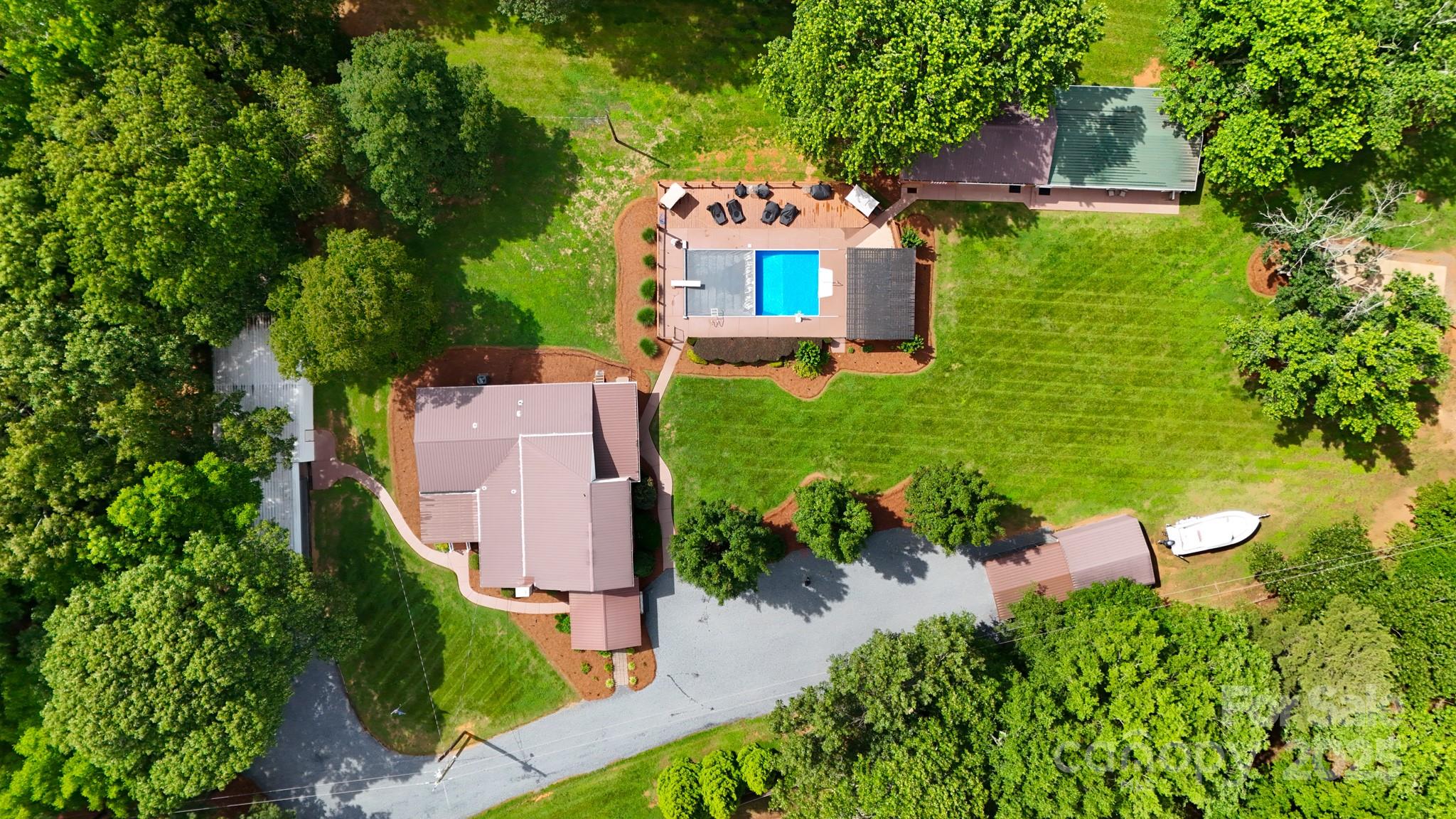 211 Drive Inn Road Locust, NC 28097 - Photo 6 of 48 an aerial view of a house with yard swimming pool and outdoor seating