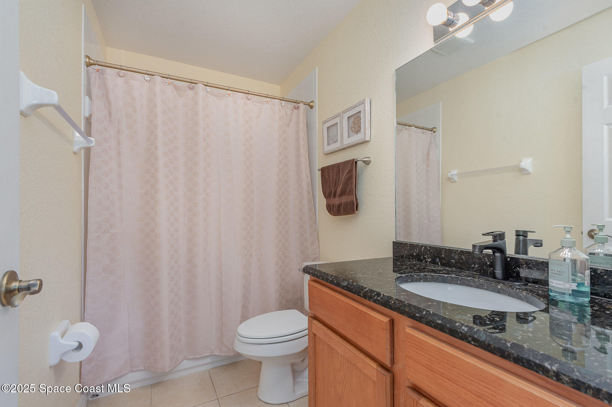 115 Turpial Way, Unit 104 Melbourne, FL 32901 - Photo 21 of 29 Updated Full Guest Bathroom