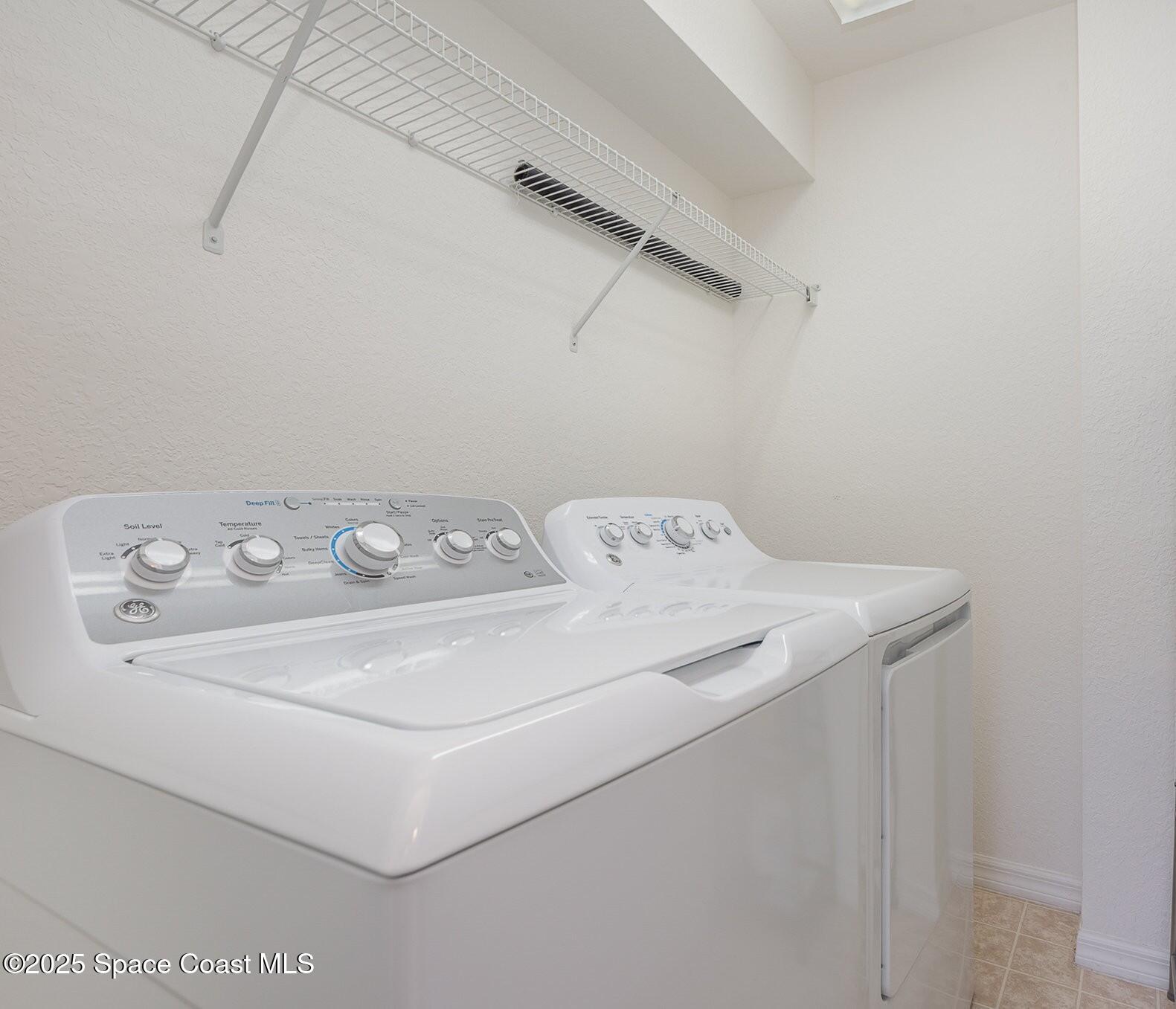 115 Turpial Way, Unit 104 Melbourne, FL 32901 - Photo 22 of 29 Laundry with Washer/Dryer