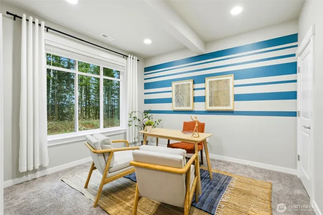 a dining room with furniture and window